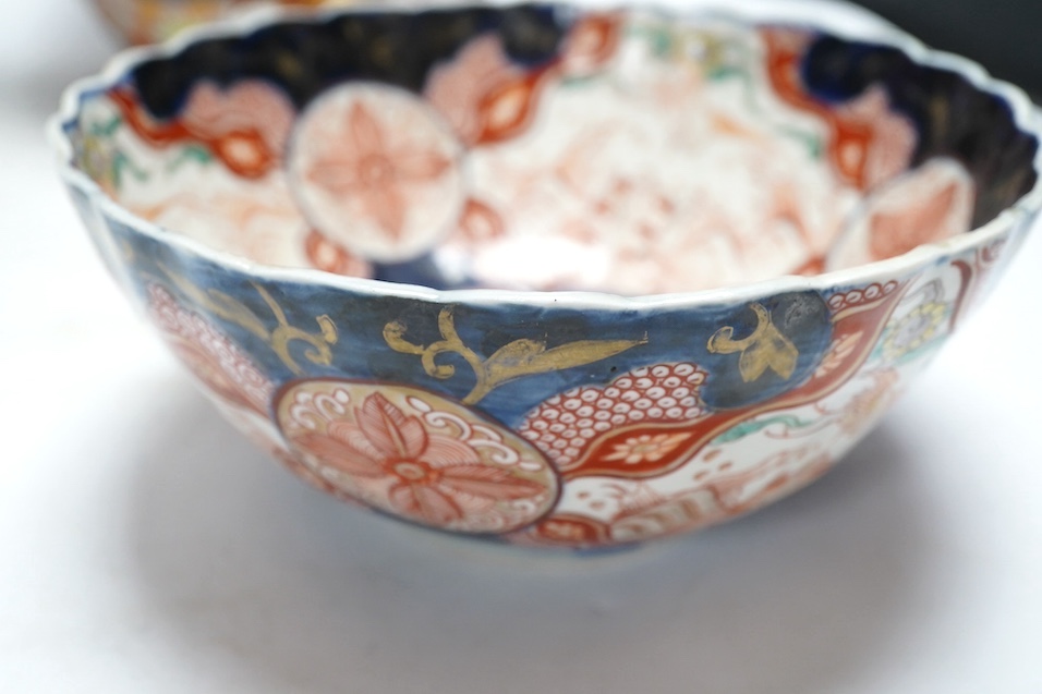 Japanese Kutani, Satsuma and Imari; four vases, a bowl, a pair of candlesticks and a pot (8). Condition - candle sticks damaged